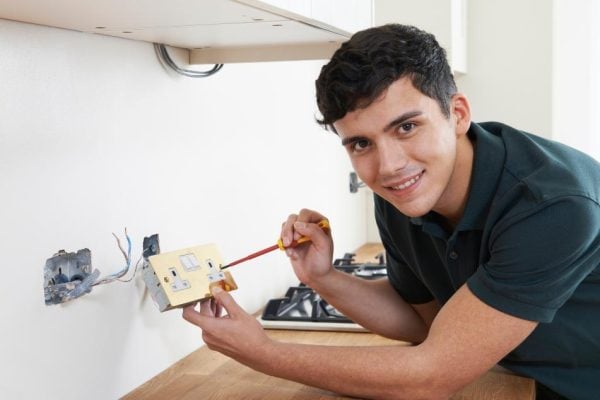 Kind Hearted Electrician Fixing Plug